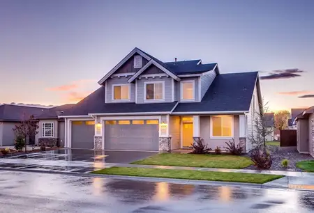 House with Driveway At Twilight